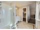 Clean bathroom with a shower, vanity, and a linen closet at 11701 Bent Oaks St, Parker, CO 80138