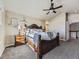 Bright bedroom with carpeted floor, a king-size bed, and a vaulted ceiling at 11701 Bent Oaks St, Parker, CO 80138