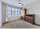 Bright bedroom with large window, carpet, and built-in wardrobe at 11701 Bent Oaks St, Parker, CO 80138