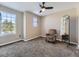 Spacious bedroom with large window and comfortable armchair at 11701 Bent Oaks St, Parker, CO 80138