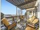 Relaxing covered patio with comfortable seating and scenic views at 11701 Bent Oaks St, Parker, CO 80138