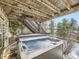 Hot tub on a deck under a wooden structure at 11701 Bent Oaks St, Parker, CO 80138