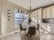 Bright kitchen nook with a charming table and chairs, offering a view at 11701 Bent Oaks St, Parker, CO 80138