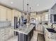 Gourmet kitchen with granite countertops, stainless steel appliances, and an island at 11701 Bent Oaks St, Parker, CO 80138