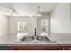 Kitchen with double sink and view into living area at 1536 Sepia Ave, Longmont, CO 80501