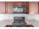 Close up of kitchen stove and microwave at 1536 Sepia Ave, Longmont, CO 80501