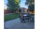 Lush backyard featuring outdoor seating, a storage shed, and mature trees at 12218 S Oak Bluff Trl, Parker, CO 80134