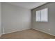 Carpeted bedroom with natural light from a window, creating a serene atmosphere at 12218 S Oak Bluff Trl, Parker, CO 80134