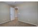 Neutral bedroom featuring carpet flooring and an open door showcasing the hallway at 12218 S Oak Bluff Trl, Parker, CO 80134