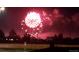 Fireworks exploding in the night sky over a suburban neighborhood at 12218 S Oak Bluff Trl, Parker, CO 80134