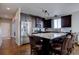 This kitchen features a large island with granite countertops, stainless steel appliances, and hardwood flooring at 12218 S Oak Bluff Trl, Parker, CO 80134