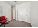 Neutral bedroom features carpet, closet, and a door to another room; perfect for an office or guest bedroom at 2212 Tamarac St, Denver, CO 80238