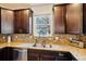 Close up of a kitchen featuring granite countertops, stainless steel appliances, and ample cabinetry at 2212 Tamarac St, Denver, CO 80238