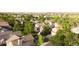 An aerial view shows a desirable community, full of mature trees and well-kept homes at 7627 Halleys Dr, Littleton, CO 80125
