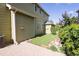 A backyard features an outdoor patio area and grass at 7627 Halleys Dr, Littleton, CO 80125