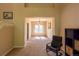 Formal dining room with neutral walls, plush carpet, chandelier, and a large window at 7627 Halleys Dr, Littleton, CO 80125