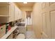 Well-organized laundry room with a front load washer and dryer set and plenty of storage space at 7627 Halleys Dr, Littleton, CO 80125