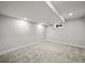 Finished basement featuring neutral carpet, white painted walls and trim, and a small window at 9591 W Florida Pl, Lakewood, CO 80232