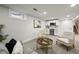 Finished basement features neutral carpet, recessed lighting, and a wet bar area at 9591 W Florida Pl, Lakewood, CO 80232
