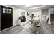 Finished basement featuring a fireplace, modern decor, and a wet bar for entertaining at 9591 W Florida Pl, Lakewood, CO 80232
