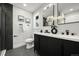 Modern bathroom with double vanity, sleek black cabinets, and stylish fixtures at 9591 W Florida Pl, Lakewood, CO 80232