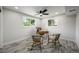 Bright bedroom featuring wood-look flooring, a ceiling fan, and lots of natural light at 9591 W Florida Pl, Lakewood, CO 80232