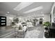 Sun-filled living room opens to modern kitchen, creating an inviting and spacious atmosphere at 9591 W Florida Pl, Lakewood, CO 80232