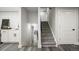 Well-lit staircase leading to the upper levels of the home, showing seamless transitions at 9591 W Florida Pl, Lakewood, CO 80232