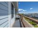 Cozy balcony featuring a relaxing chair and a small table, perfect for enjoying the outdoor scenery and fresh air at 6260 Everett Ct # D, Arvada, CO 80004