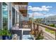 Inviting balcony with comfortable seating and blue rug, a perfect outdoor lounge space at 6260 Everett Ct # D, Arvada, CO 80004