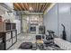 Spacious unfinished basement with washer, dryer, and weights, offering versatile space for storage or hobbies at 6260 Everett Ct # D, Arvada, CO 80004