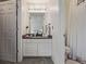 Updated bathroom featuring a modern vanity, large mirror, stylish lighting, and a separate shower with glass door at 6260 Everett Ct # D, Arvada, CO 80004