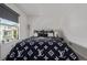 A well decorated bedroom featuring a large window and modern finishes at 6260 Everett Ct # D, Arvada, CO 80004