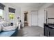 Comfortable bonus room with seating area, modern furnishings, and a view of the ensuite bathroom at 6260 Everett Ct # D, Arvada, CO 80004