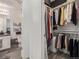 Functional closet and organized shelving with ample space located next to a full bathroom at 6260 Everett Ct # D, Arvada, CO 80004