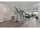 Inviting entry with contemporary decor, stylish staircase, and bright, open design at 6260 Everett Ct # D, Arvada, CO 80004