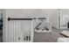 Hallway area with white decorative shelving and black railing at 6260 Everett Ct # D, Arvada, CO 80004