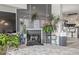 Cozy living room area with gray fireplace, potted plants, and decorative accents at 6260 Everett Ct # D, Arvada, CO 80004