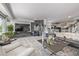 Open-concept living space with modern decor, natural light, and a seamless flow to the kitchen at 6260 Everett Ct # D, Arvada, CO 80004