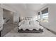Bright bedroom with large window and soft, plush bedding at 6260 Everett Ct # D, Arvada, CO 80004