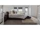 Spacious main bedroom featuring a large window and walk-out balcony overlooking lush greenery and a comfy chaise lounge at 6260 Everett Ct # D, Arvada, CO 80004