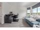 Well-lit office with a functional desk, comfortable seating, and a scenic view, perfect for working from home at 6260 Everett Ct # D, Arvada, CO 80004