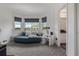 Cozy sitting area with a daybed, decorative pillows, and large windows offering picturesque views of the surrounding landscape at 6260 Everett Ct # D, Arvada, CO 80004