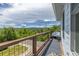 Balcony boasting scenic views of treelines and mountains offering a tranquil retreat at 6260 Everett Ct # D, Arvada, CO 80004