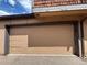 Garage door highlighting its neutral color and design, offering secure access to the home at 1203 S Crystal Way, Aurora, CO 80012