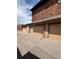 Exterior shot of home garages with multiple doors and asphalt driveway, showcasing curb appeal at 1203 S Crystal Way, Aurora, CO 80012