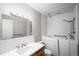 Bathroom with walk-in tub, updated vanity, and subway tile backsplash at 495 S Dayton St # 1D, Denver, CO 80247