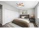 Nicely decorated bedroom featuring a bed, nightstand, and a window with natural light at 495 S Dayton St # 1D, Denver, CO 80247