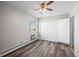 Bedroom with ceiling fan, closet, and new flooring at 495 S Dayton St # 1D, Denver, CO 80247