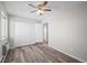 Bedroom with ceiling fan, closet, and new flooring at 495 S Dayton St # 1D, Denver, CO 80247